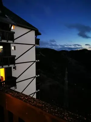 a building with a view of the mountains at Jolly Kop, Villa Jovana, apartman 18 in Kopaonik