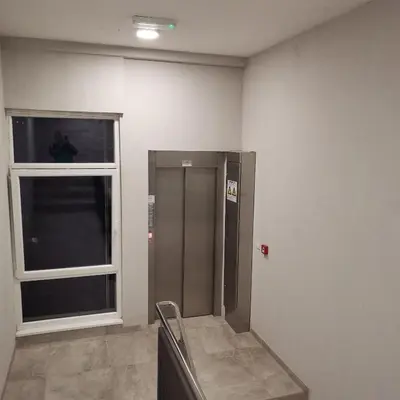 a elevator in a room with a window at Apartman Lea & parking u garaži in Soko Banja