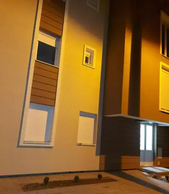 a building with windows and blinds on it at Vrnjačka Banja Apartman in Vrnjačka Banja