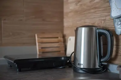 a coffee pot sitting on top of a counter at Apartman Klara S 23 in Kopaonik