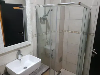 a bathroom with a sink and a shower at Apartman K5 Milmari Resort in Kopaonik