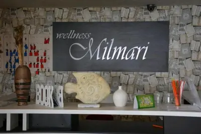 a table with a sign that reads wellness millennium at Apartman K5 Milmari Resort in Kopaonik