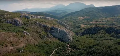 a view of a mountain valley with trees and mountains at Dom sa pogledom Jela in Jelašnica