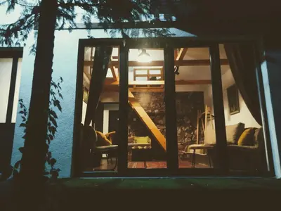 a view of a house through a window at Dom sa pogledom Jela in Jelašnica