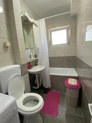 a bathroom with a toilet and a sink and a tub at Apartman - stan na dan LENJINKA in Vranje