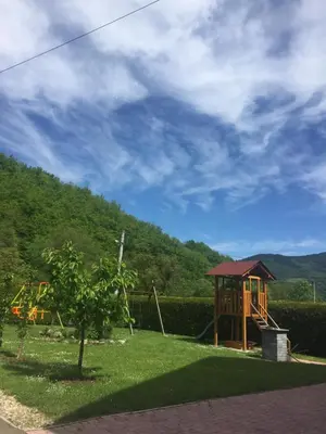 a park with a playground on a hill at Vila Jakovljević in Jošanička Banja