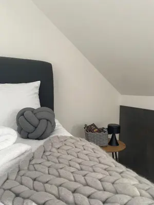 a bedroom with a bed with two towels on it at Vila Planinsko Blago in Kopaonik