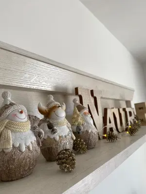 a shelf with christmas ornaments on it at Dream View Apartment in Kopaonik