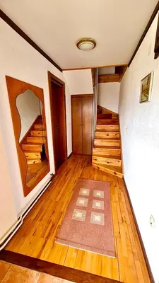 an empty hallway with wooden floors and wooden stairs at Vila Djordjevic - Priroda vas okruzuje in Brus