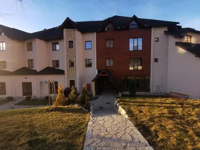 a large house with a stone path in front of it at Milmari P79 in Kopaonik