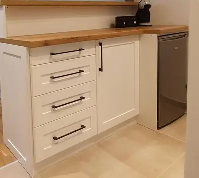 a kitchen with white cabinets and a counter top at Vila Irina Kopaonik - Apartman IN in Kopaonik