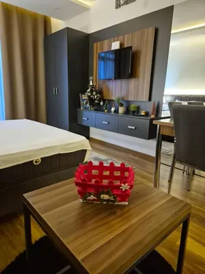 a room with a bed and a table in a room at President Kop S9, S3 & A103 in Kopaonik