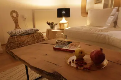 a living room with a table with a tray of fruit on it at 4Badgers / 4Jazavca - Mountain House in Kopaonik