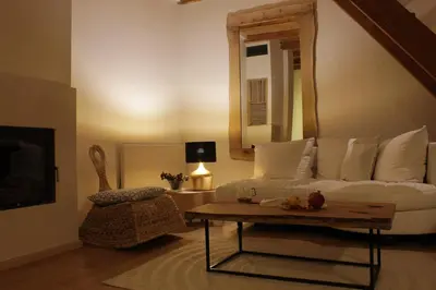a living room with a white couch and a table at 4Badgers / 4Jazavca - Mountain House in Kopaonik