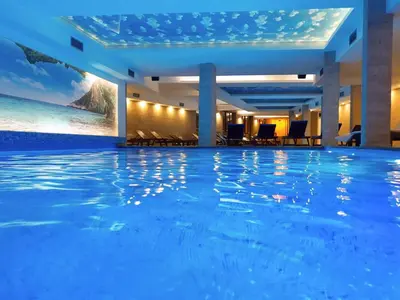a hotel swimming pool with a view of the ocean at P20 Milmari, DeLuxe Studio, Kopaonik in Kopaonik