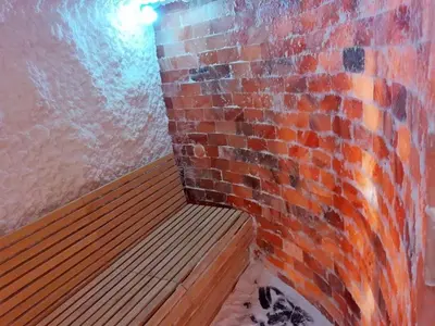 a room with a brick wall and a wooden bench at P20 Milmari, DeLuxe Studio, Kopaonik in Kopaonik