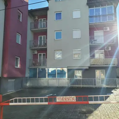 a row of tall buildings next to a street at Apartment Atria in Vrnjačka Banja