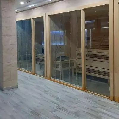 an empty room with glass windows in a building at Apartman D16 Milmari Kopaonik in Kopaonik