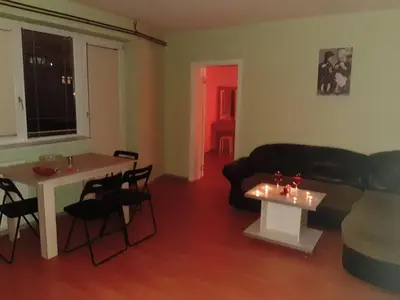 a living room with a couch and a table at Lux Apartmani Nikola in Vrnjačka Banja