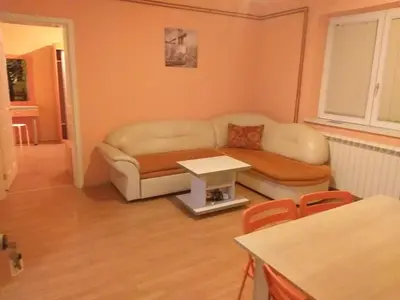 a living room with a couch and a table at Lux Apartmani Nikola in Vrnjačka Banja