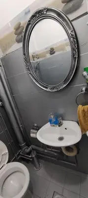 a bathroom with a sink and a mirror at Apartman Jasna, in Pirot