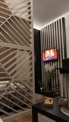 a living room with a wooden wine cellar at Grand Elegant & Spa Kop in Kopaonik