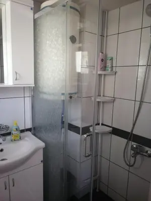 a bathroom with a shower and a sink at Vikendica Lep pogled in Rtanj