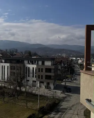 a view of a city with mountains in the distance at MILA in Vrnjačka Banja