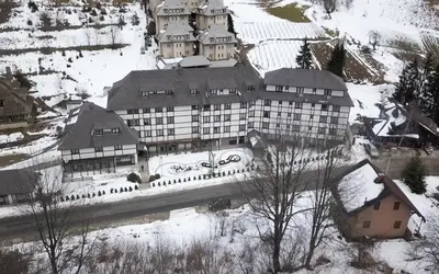 a large building on top of a snow covered mountain at BELI VUK - Brzeće, Kopaonik in Brzeće