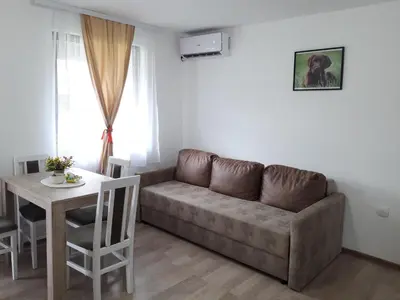 a living room with a couch and a table at Stan KALA in Vrnjačka Banja