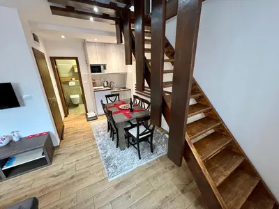 an overhead view of a kitchen and a dining room at Apartmani Vidatela Kopaonik in Kopaonik
