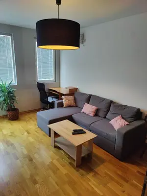 a living room with a couch and a coffee table at Apartman Aleksic in Niš