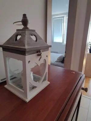 a bird house sitting on top of a table at Apartman Aleksic in Niš