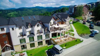 an aerial view of a large house in a city at Apartments S73&S74 Milmari Resort, Kopaonik in Kopaonik
