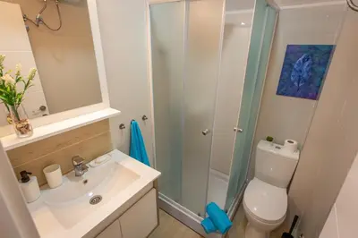 a bathroom with a toilet and a sink and a shower at Apartments View Dvori E25 in Kopaonik