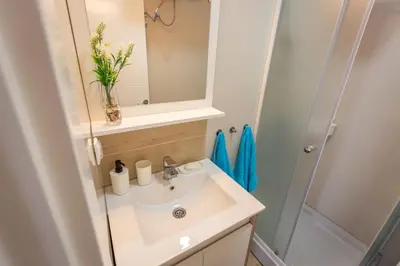 a bathroom with a sink and a mirror at Apartments View Dvori E25 in Kopaonik