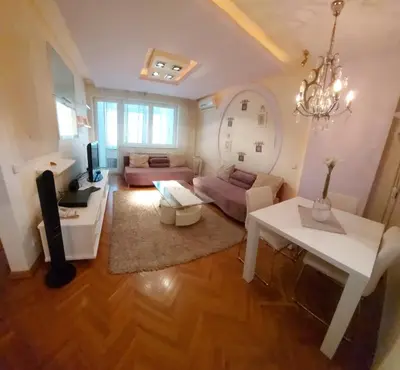 a living room with a couch and a table at Hotel Crystal - Depandans in Kraljevo