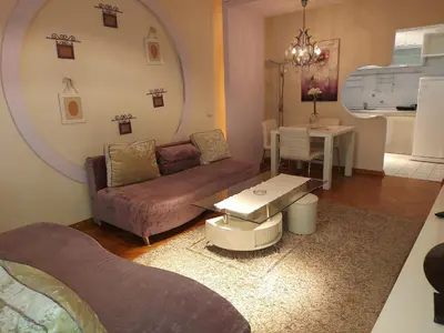 a living room with a couch and a table at Hotel Crystal - Depandans in Kraljevo