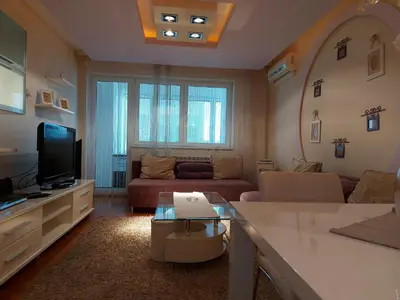 a living room with a couch and a tv at Hotel Crystal - Depandans in Kraljevo