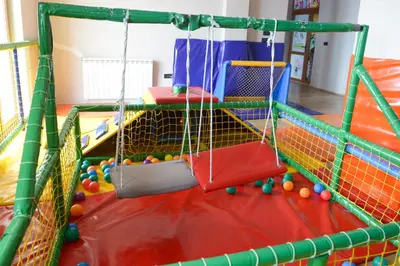 an indoor play area with a net and balls at Apartman Milmari Idila in Kopaonik