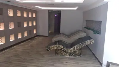 a room with a bench in the middle of a building at Apartman Milmari Idila in Kopaonik