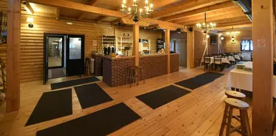 a room with mats on the floor of a building at Lonka apartman Kopaonik in Kopaonik