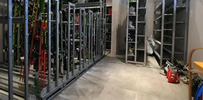 a room filled with lots of skis in a store at Lonka apartman Kopaonik in Kopaonik