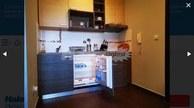a kitchen with an open refrigerator in a room at Studio Jolly Kop Jana 2 in Kopaonik