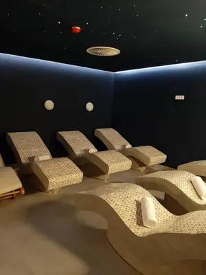 a group of chairs in a room with stars on the ceiling at Apartman DiamondLux Vrnjacka Banja in Vrnjačka Banja