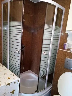 a shower with a glass door in a bathroom at Apartman Gordana in Vrnjačka Banja