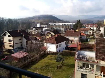 a view of a city with houses and mountains at Apartman Gordana in Vrnjačka Banja