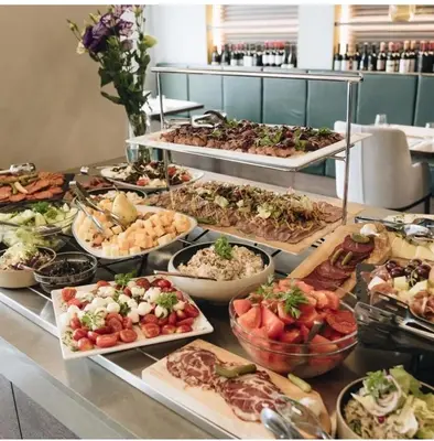 a buffet line with many different types of food at NOVAK apartman in Vrnjačka Banja
