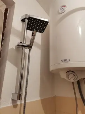 a shower in a bathroom with a sink at Vila Milica in Kraljevo