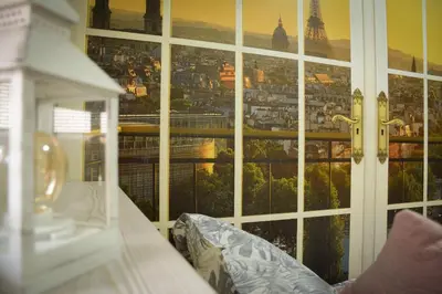 a large window with a view of a city at Apartman La Casa Di Elena in Vrnjačka Banja